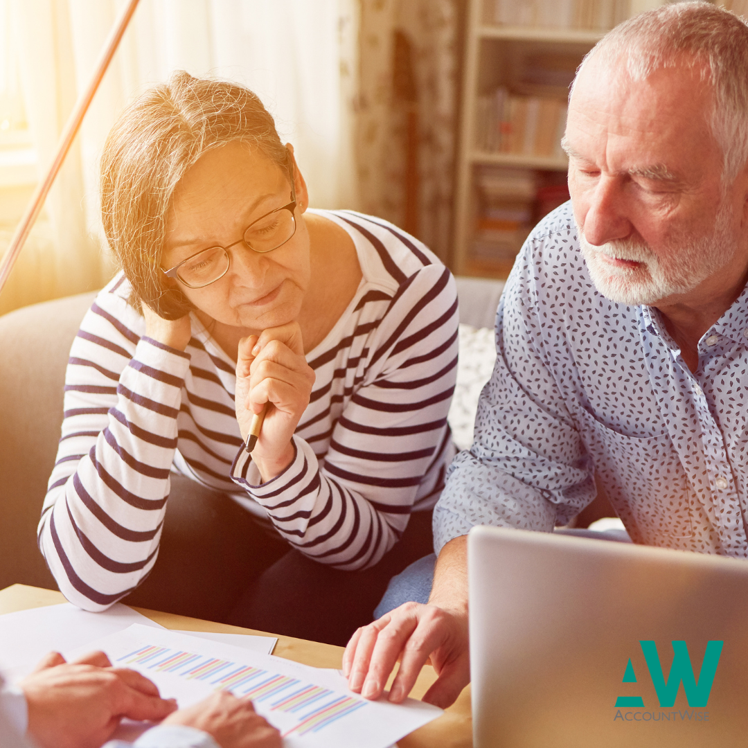 couple looking at the pension, deciding if they have missing years for their Home Responsibilities Protection