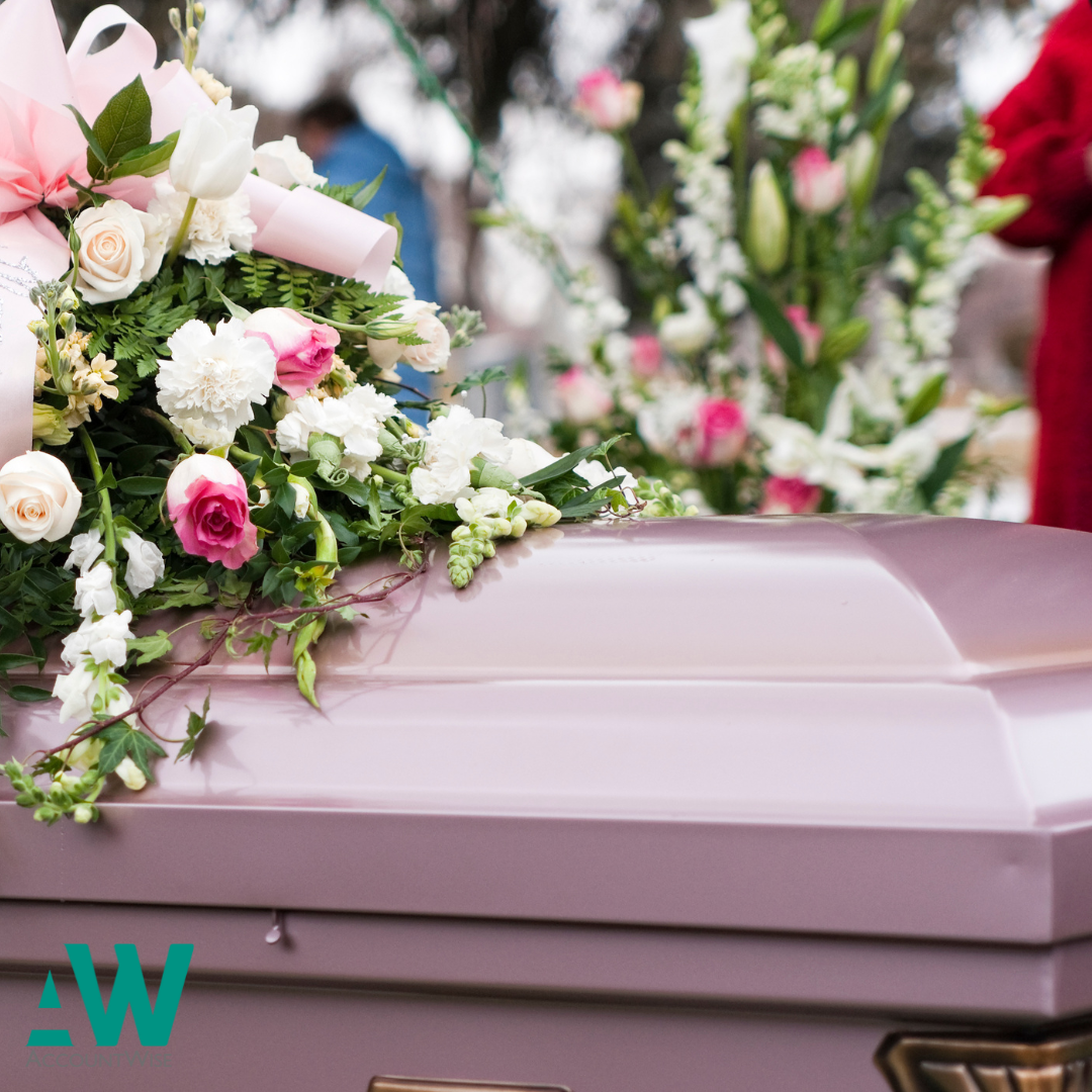 A picture of a coffin at a funeral
