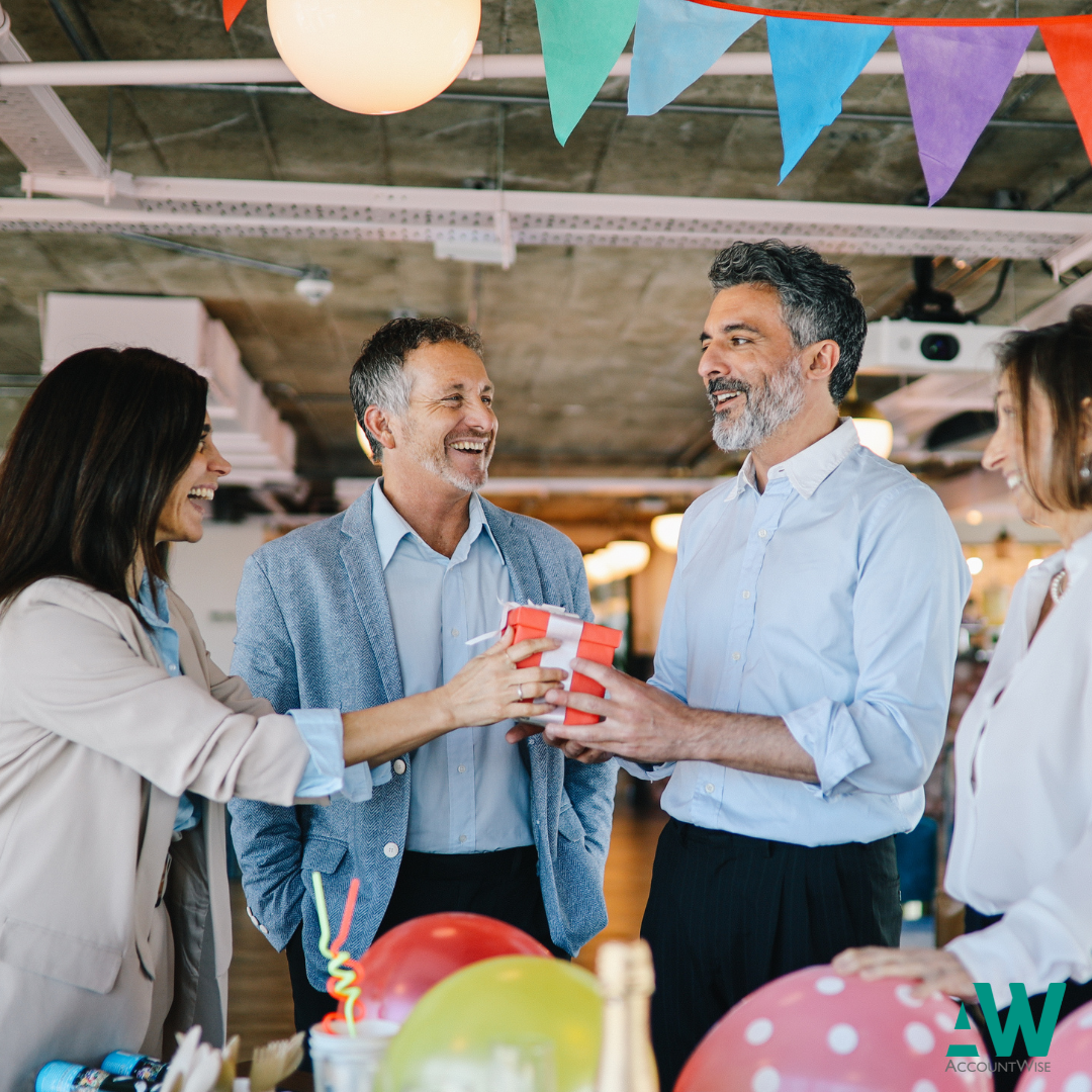 An employee receiving a present for his birthday