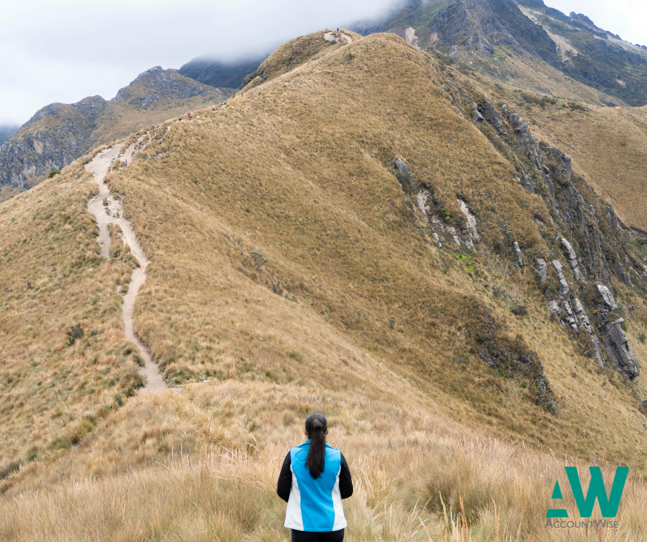 A women climbing up a mountain